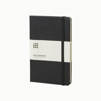 Moleskines stora anteckningsböcker (ca A5) med linjerade eller rutade sidor - med reklamtryck